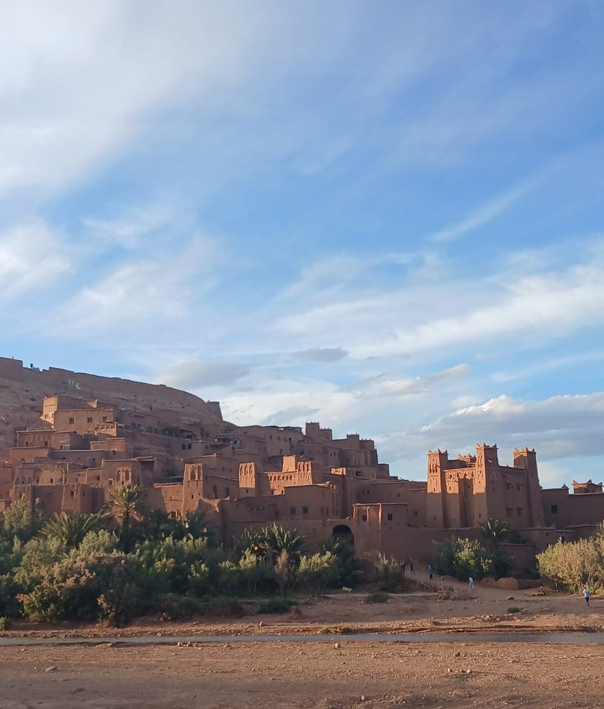 The earthen kasbah of Aït Ben Haddou rising above the palm groves, Ouarzazate Morocco