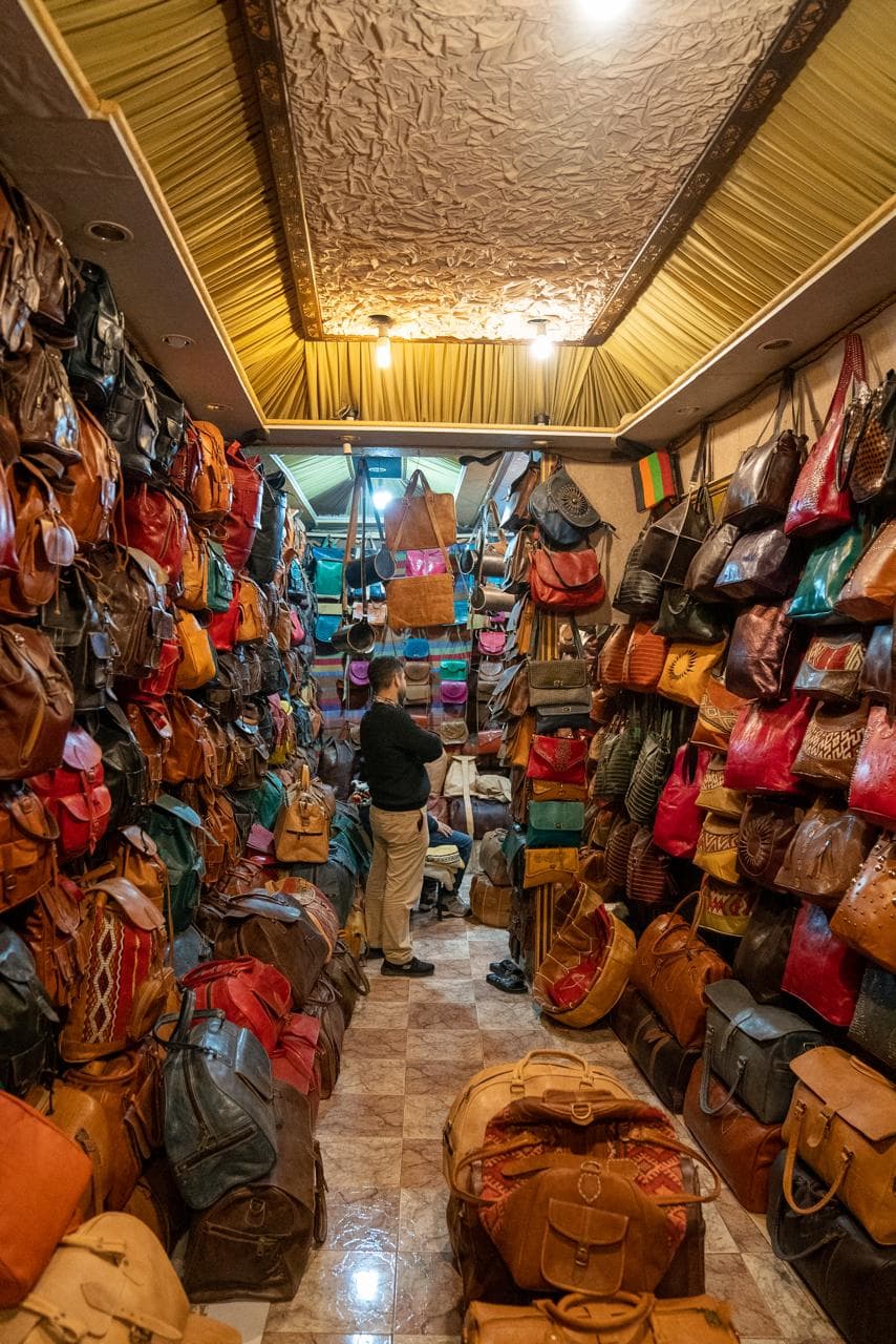 A leather shop in the Fes medina hung floor to ceiling with bags and satchels tanned at the Chouara tannery, Morocco