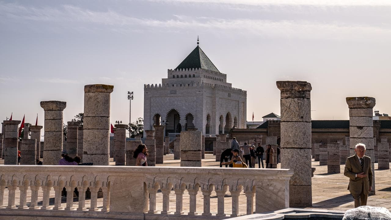 The Mausoleum of Mohammed V seen across the field of broken columns on the Hassan esplanade, Rabat Morocco