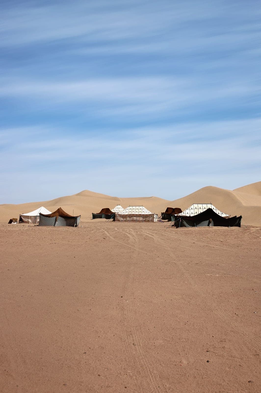 Berber tents pitched below the dunes of Erg Chegaga, Draa Valley, Morocco