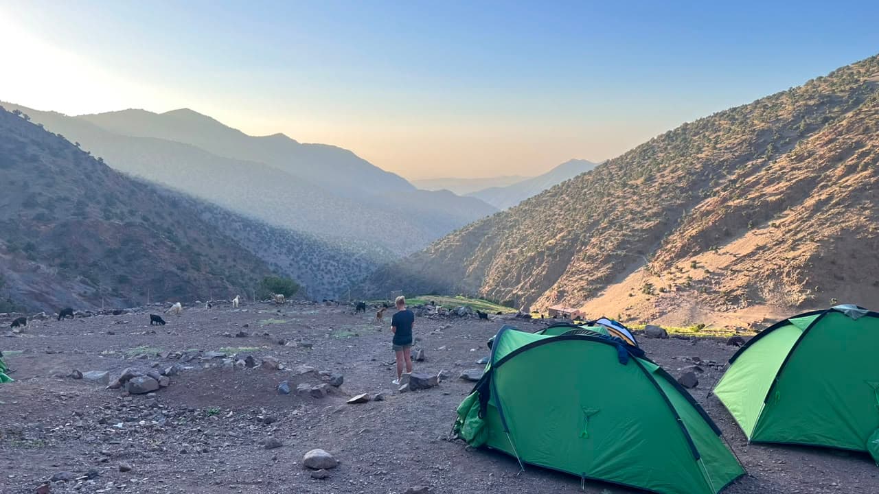 Our trek camp pitched above a High Atlas valley at golden hour, Morocco