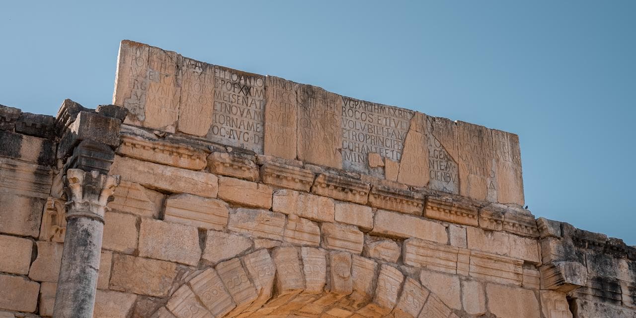 The Latin dedication inscription along the attic of the Arch of Caracalla at Volubilis, Morocco